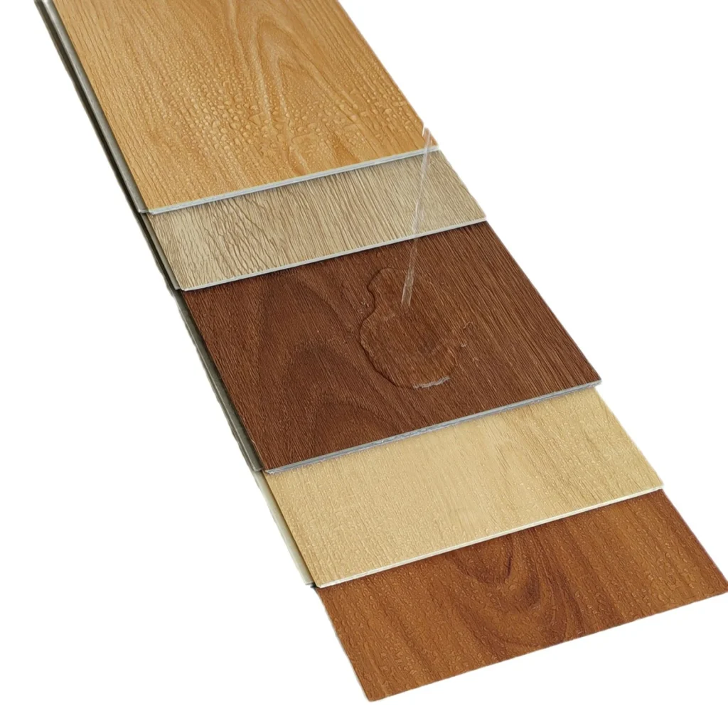 Wood-look SPC flooring samples with different grain patterns and surface finishes.